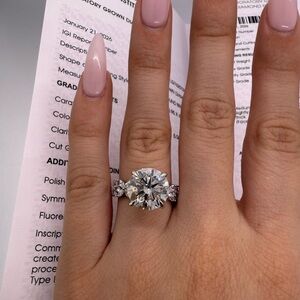 5.06 carat E VVS2 round lab diamond with floral marquise band engagement ring